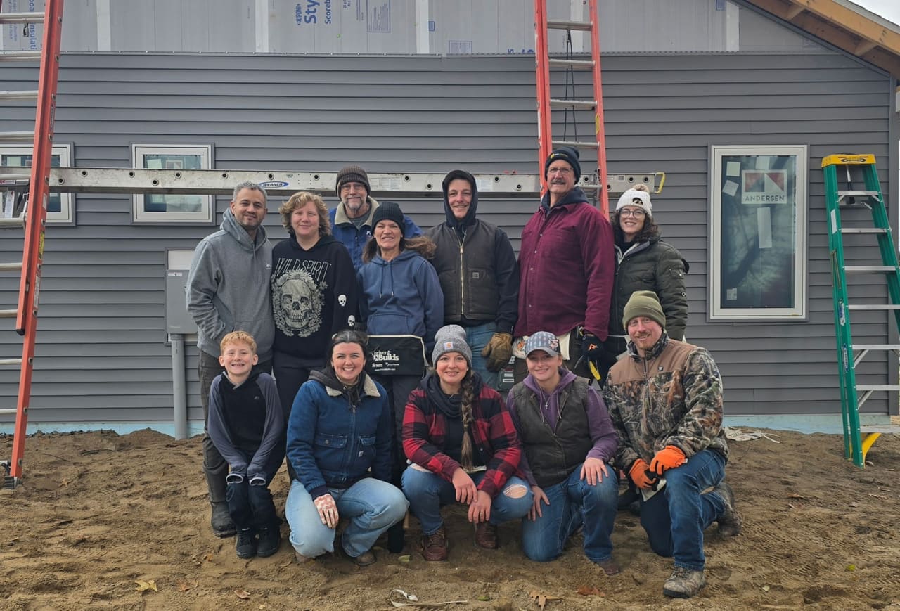 Habitat for Humanity Barry County volunteers gathered in front of a home under construction